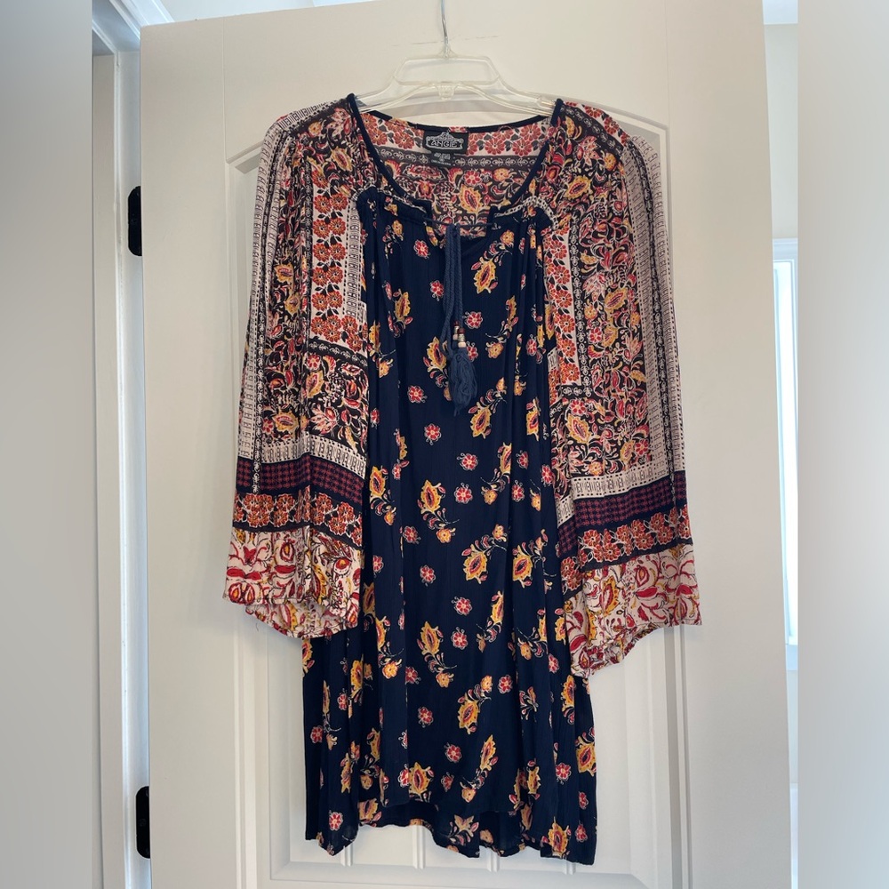 Fun, light dress that falls above the knee! Perfect for any occasion!